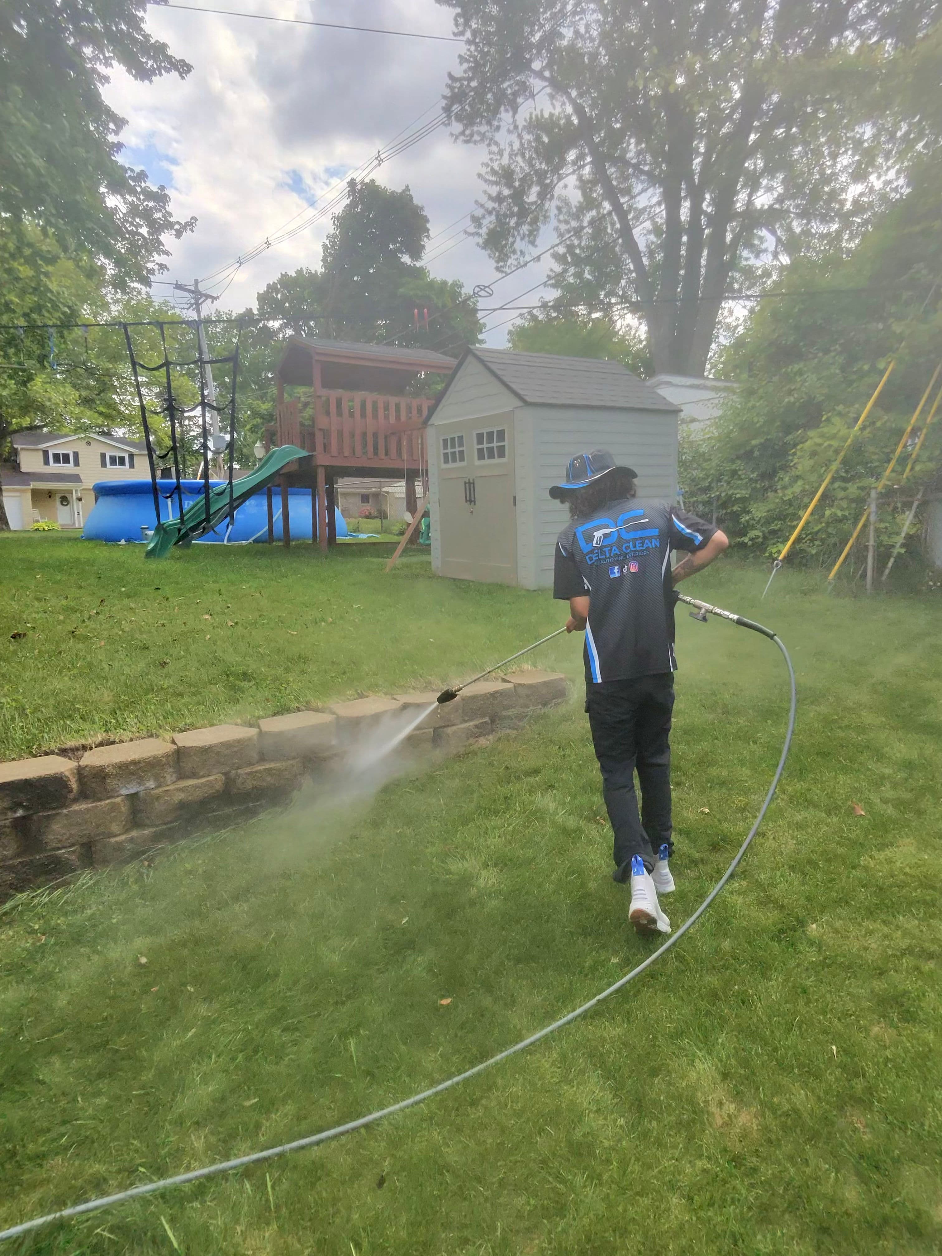 Project Stone Retaining Wall Cleaned From Mossy Green to Like-New image
