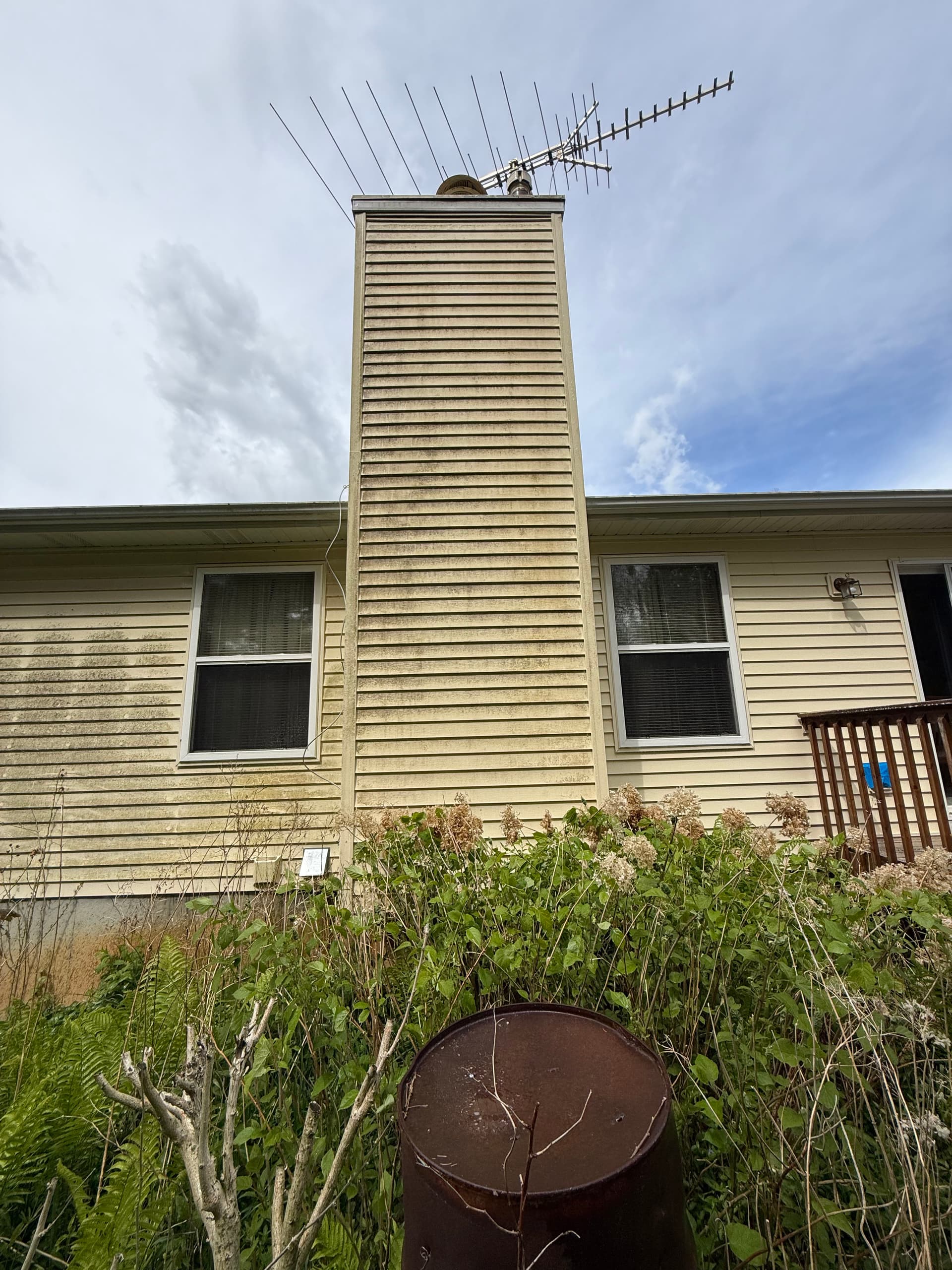 Stained Siding and a Weathered Deck Get a Full Clean image
